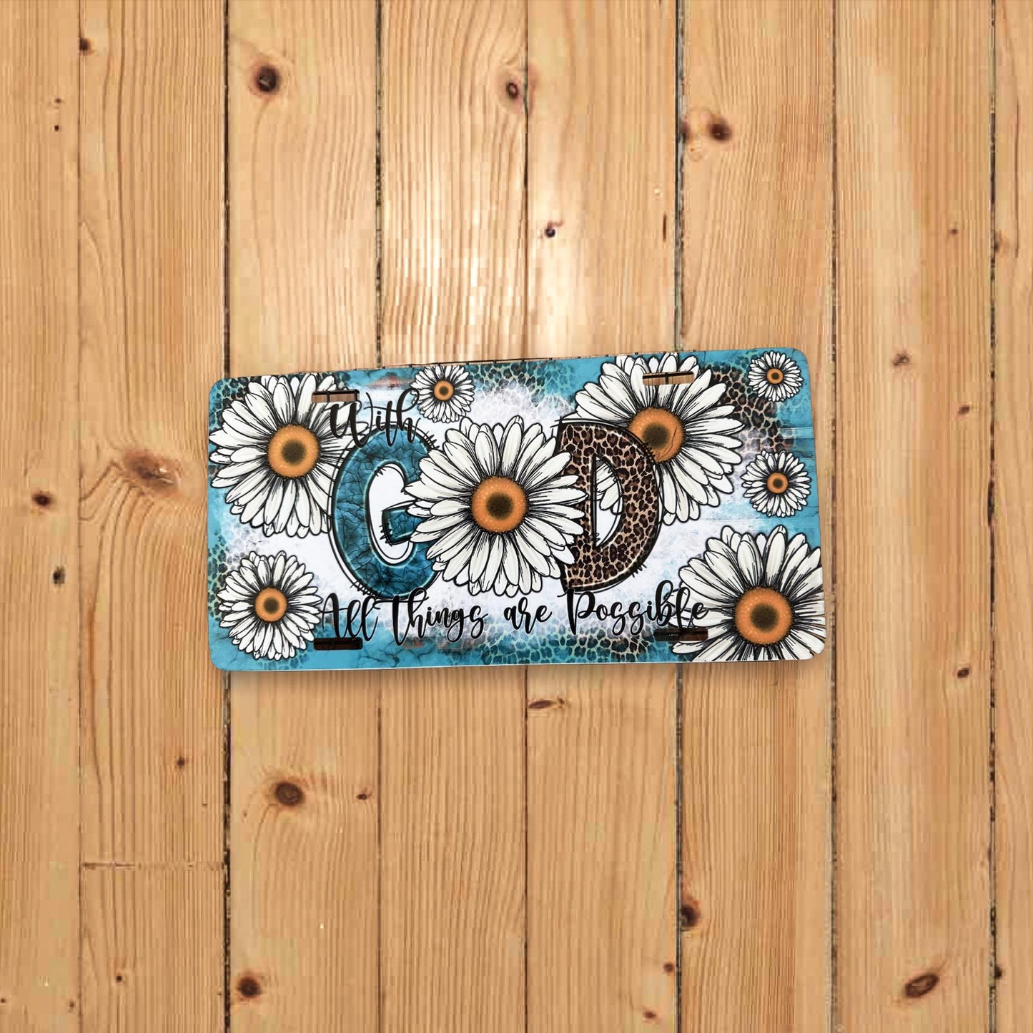 Decorative card with floral design and text on a wooden surface