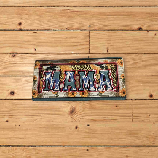 Custom metal license plate with black embossed letters reading "MAMA"